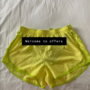 Nike running shorts women’s neon green yellows